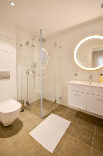 a bathroom with a shower and a toilet and a sink at לביא אילת lavie eilat in Eilat