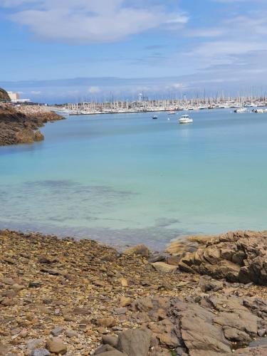 a view of a harbor with boats in the water at Le Grand Domaine du Rocher in Bonnemain