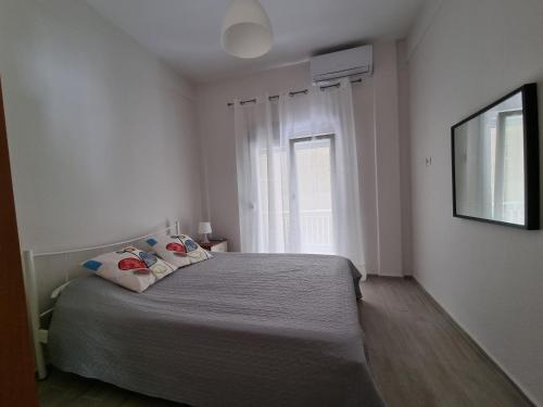 Katil atau katil-katil dalam bilik di Cosy and modern appartment in Olympiada