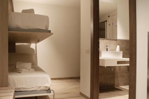 a bathroom with a bunk bed and a sink at Best Quality Hotel Politecnico in Turin