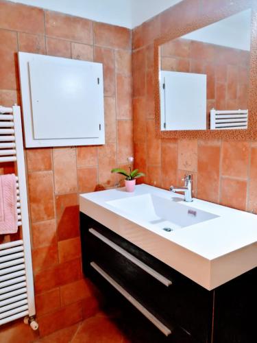 a bathroom with a sink and a mirror at Casamare Baldassarri in Civitanova Marche