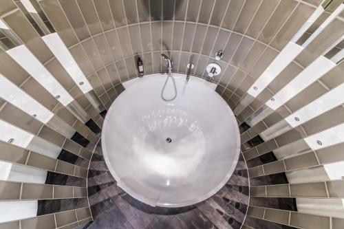 a bathroom with a white toilet in a room at Liebeskind Boutique Hotel Old Town in Kraków