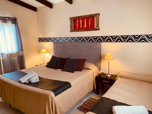 Un pat sau paturi într-o cameră la Los Carolinos by DOT Cabana