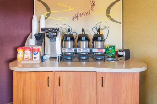 a counter with a coffee maker on top of it at Red Roof Inn Jacksonville Airport in Jacksonville
