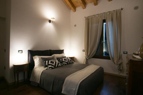 Una cama o camas en una habitación de Ca' Gemma