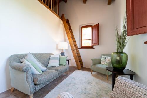 a living room with a couch and two chairs at Agriturismo Il Sarale - Umbria in Città di Castello