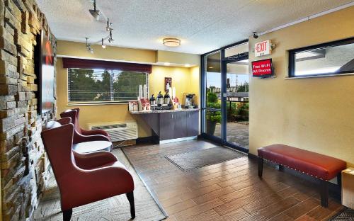 a barber shop with two chairs and a barbershop at Red Roof Inn Louisville Fair and Expo in Louisville