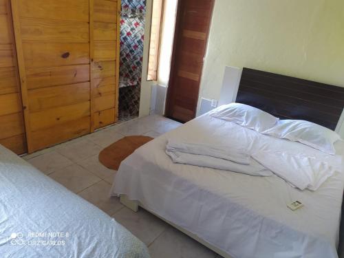 Postel nebo postele na pokoji v ubytování pousada cangaço