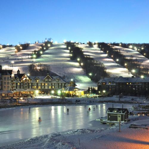 a town with a river in the snow at night at Great Location, Pool, Blue Mountain 2 BDRM Dream in Blue Mountains