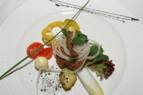 a plate of food on a white plate at Wohlmuth-Lückl in Kitzeck im Sausal
