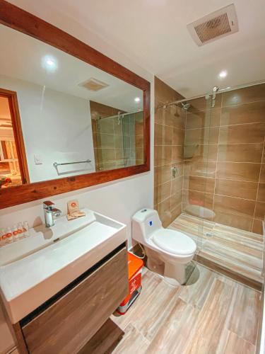 a bathroom with a sink and a toilet and a shower at In Di House of Reggae Boutique in San Andrés