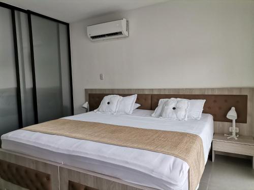Säng eller sängar i ett rum på Berilo Deluxe Apartahotel