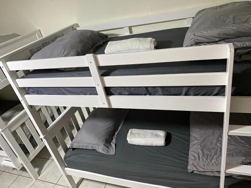a pair of bunk beds in a room at Single Size TOP Bunk Bed - Mixed Shared ROOM in Miami