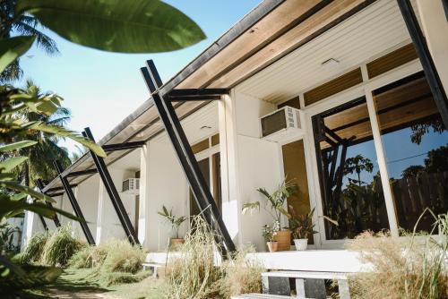 a house with a large glass door at Suyog Life Siargao in General Luna