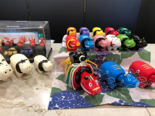 a group of toy train figurines on a table at Hotel Sankyo Fukushima in Fukushima
