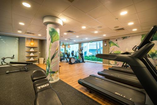 a gym with treadmills and exercise bikes in a room at Yam Suf by Isrotel Collection in Eilat