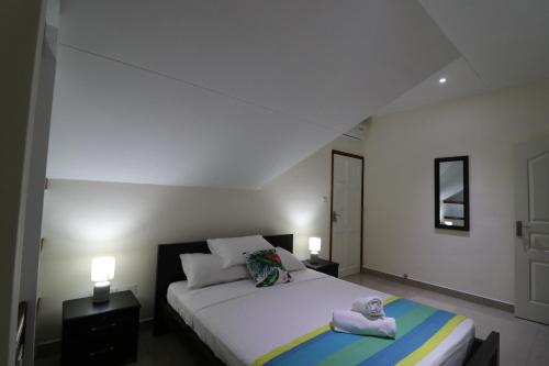 En eller flere senge i et værelse på Le Ronce Villa