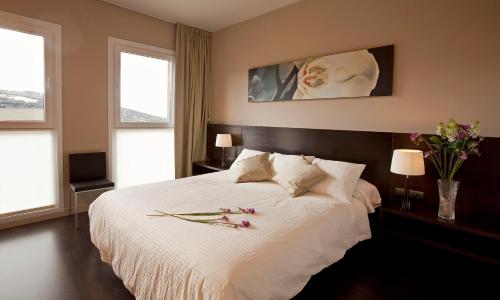 Un pat sau paturi într-o cameră la Hotel Rural Valdorba