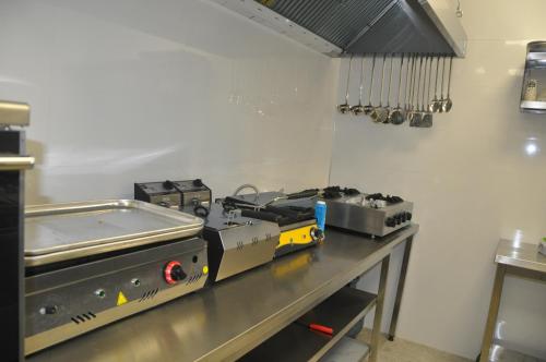 a machine on a table in a kitchen at GOLAZ SUİT OTEL in Ankara