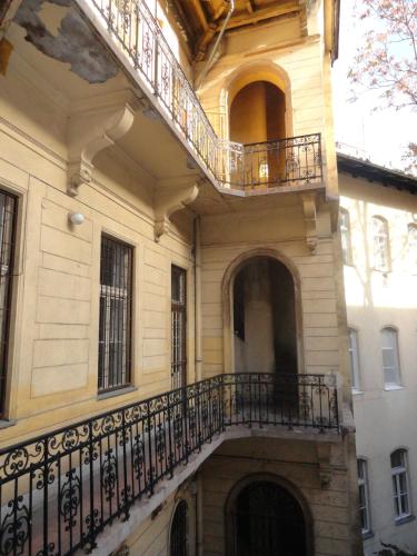 a building with a balcony on the side of it at Boudoir Budapest Apartment in Budapest