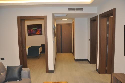 a living room with a couch and a table at GOLAZ SUİT OTEL in Ankara