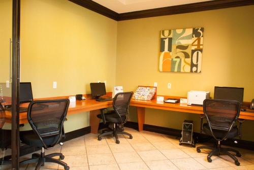 an office with a desk with chairs and computers on it at Best Western Plus Miami-Doral/Dolphin Mall in Miami