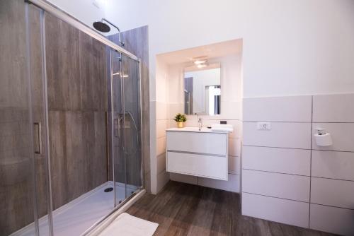 a bathroom with a shower and a sink at Budapest Easy Flat Oktogon in Budapest