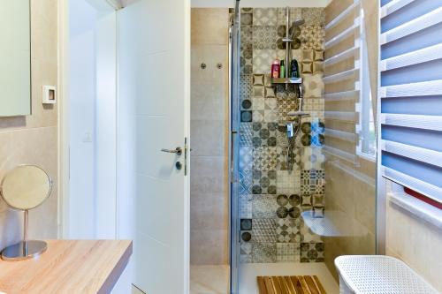 a shower with a glass door in a bathroom at Villa Luciana Spa House, Buje in Buje