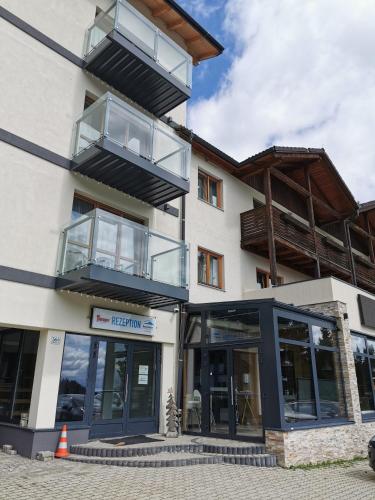 a building with two balconies on top of it at Alpengasthof Tanzstatt in Lachtal