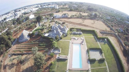 an aerial view of a house on a hill at Trulli Paparale in Alberobello