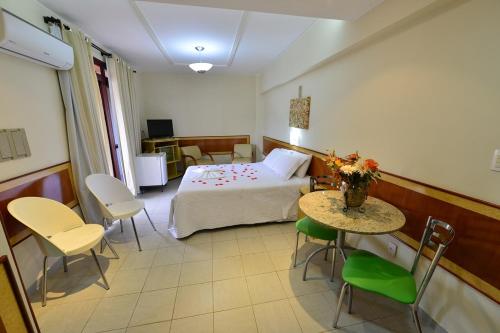 Ένα ή περισσότερα κρεβάτια σε δωμάτιο στο Vind's Plaza Hotel
