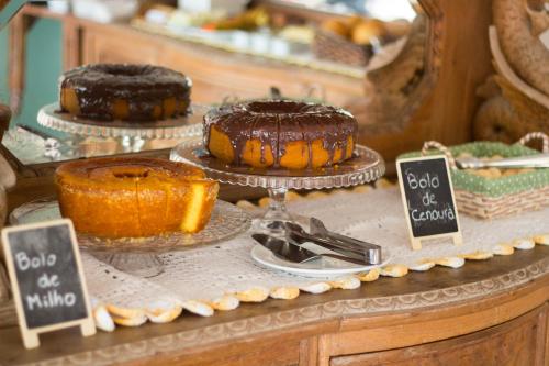 a buffet with chocolate cakes and other desserts on display at Pousada Estrelas no Mar Florianópolis in Florianópolis