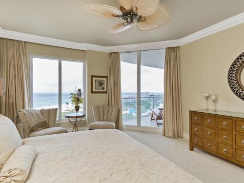 a bedroom with a large bed with a view of the ocean at Ritz Carlton Luxurious Residence on Singer Island in Riviera Beach