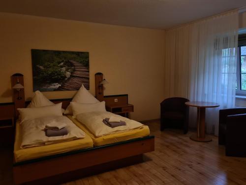 Tempat tidur dalam kamar di Landgasthof Hoffnung