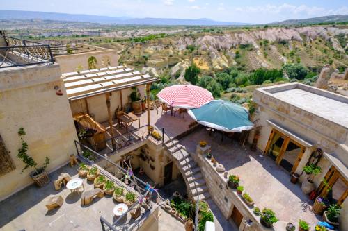 an overhead view of a building with an umbrella at Pigeon Hotel Cappadocia in Uchisar
