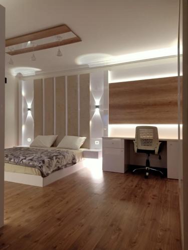 a bedroom with a bed and a desk with a computer at Sheraton Ocean 704 - Without Pool access in Cairo