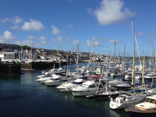 a bunch of boats are docked in a harbor at Camelot Guest House in Falmouth