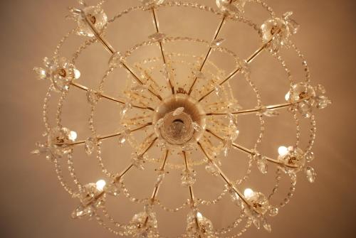 a chandelier hanging from a ceiling at The Bed + Breakfast in Luzern