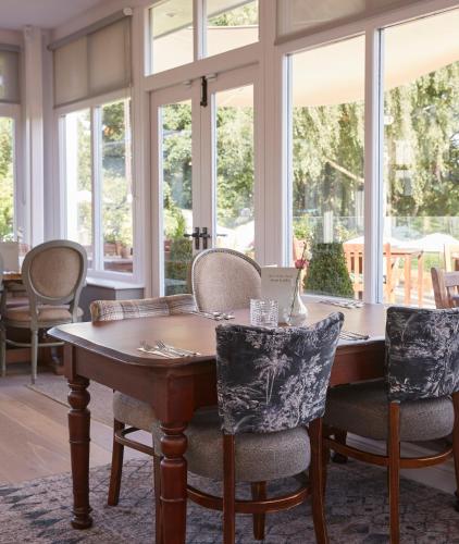 a dining room with a table and chairs at Riverside Inn by Chef & Brewer Collection in Shrewsbury