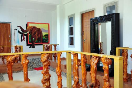 a room with a picture of an elephant on the wall at DELIGHTFUL HOMESTAY in Sollebail
