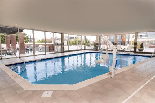 a large swimming pool with a slide in a building at Staybridge Suites Nashville - Vanderbilt Area by IHG in Nashville