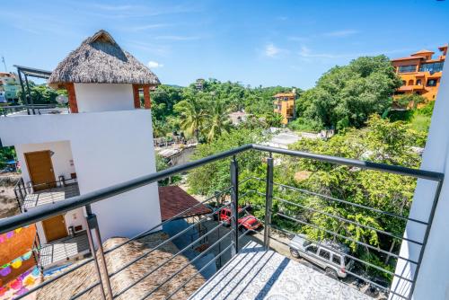 a view from the balcony of a house at Viajero Sayulita Hostel in Sayulita