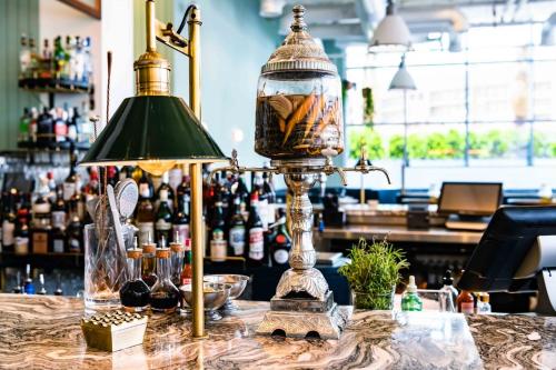 a lamp sitting on a table in a bar at Studio One Hotel in Dubai