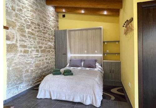 Katil atau katil-katil dalam bilik di Apartamentos de turismo rural Las Eras
