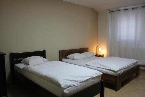 Postel nebo postele na pokoji v ubytování Hotel Pod Zelenou