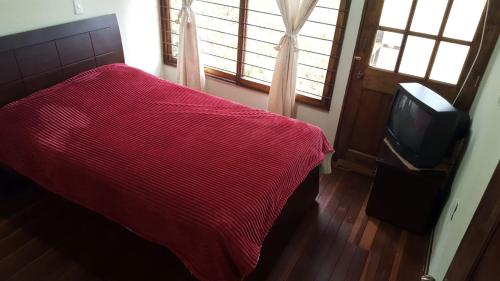 TV a/nebo společenská místnost v ubytování Cabaña Santo Domingo