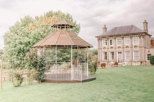 a gazebo in a yard in front of a building at Ednam House Hotel in Kelso