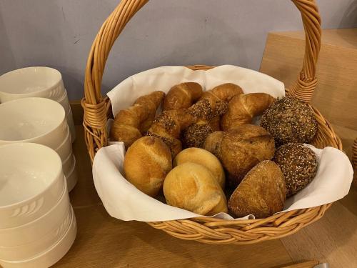 a basket filled with lots of different types of donuts at Boutique City Hotel Gallo in St. Gallen