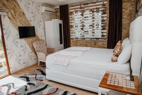Una cama o camas en una habitación de Sinter Terasse House Hotel