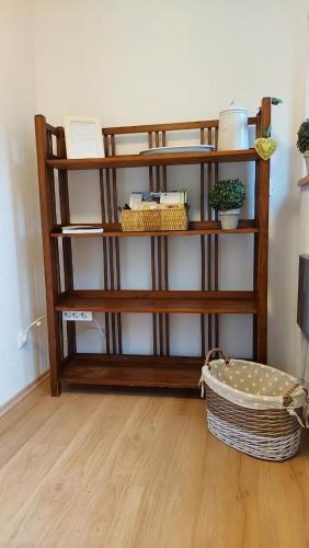 a shelf in a room with a basket on the floor at Haus Fritz - Erholung in den Bergen in Donnersbachwald